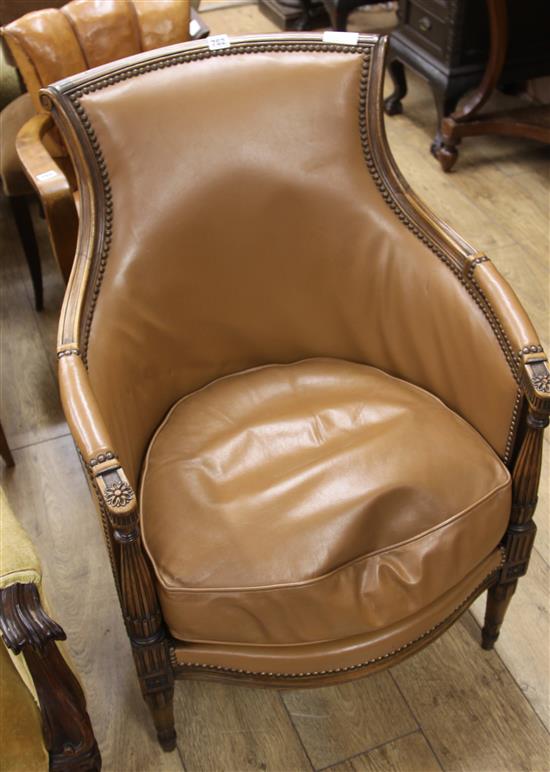 A French beech and leather armchair